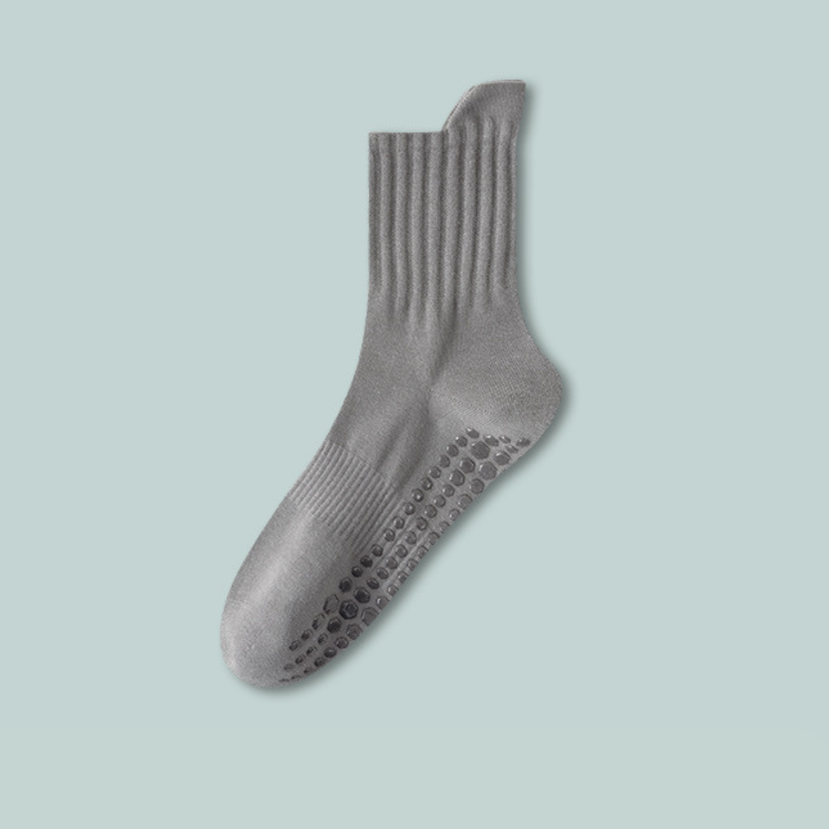 Gray sock with textured sole on a light blue background