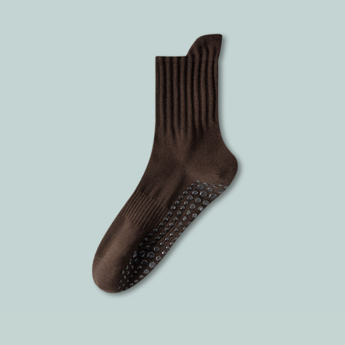 Brown sock with textured sole on a light blue background